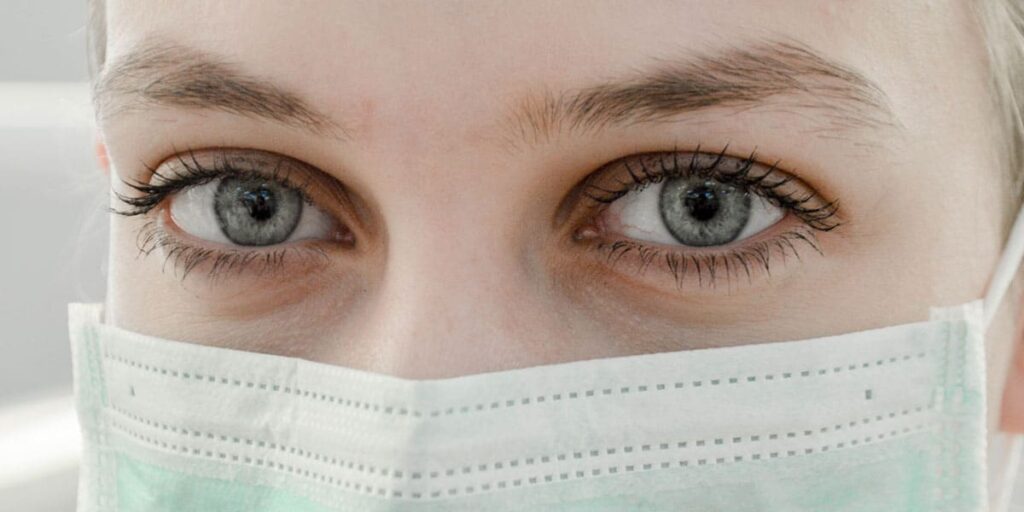 Person wearing a medical mask.