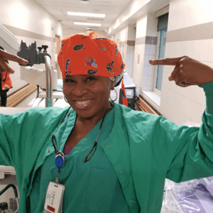 Nurse wearing colorful scrub cap.