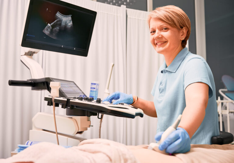 Doctor performing ultrasound examination.