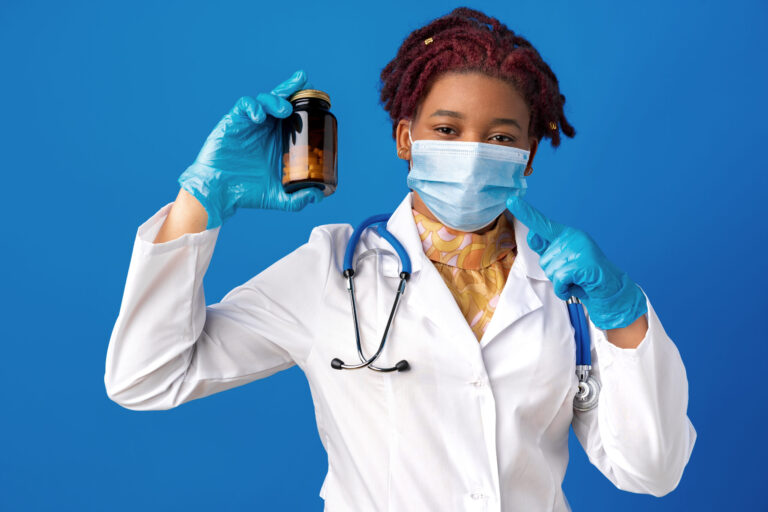 Doctor holding a glass jar.