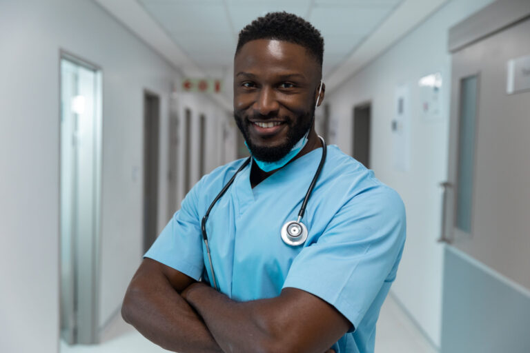 Doctor in scrubs with stethoscope.