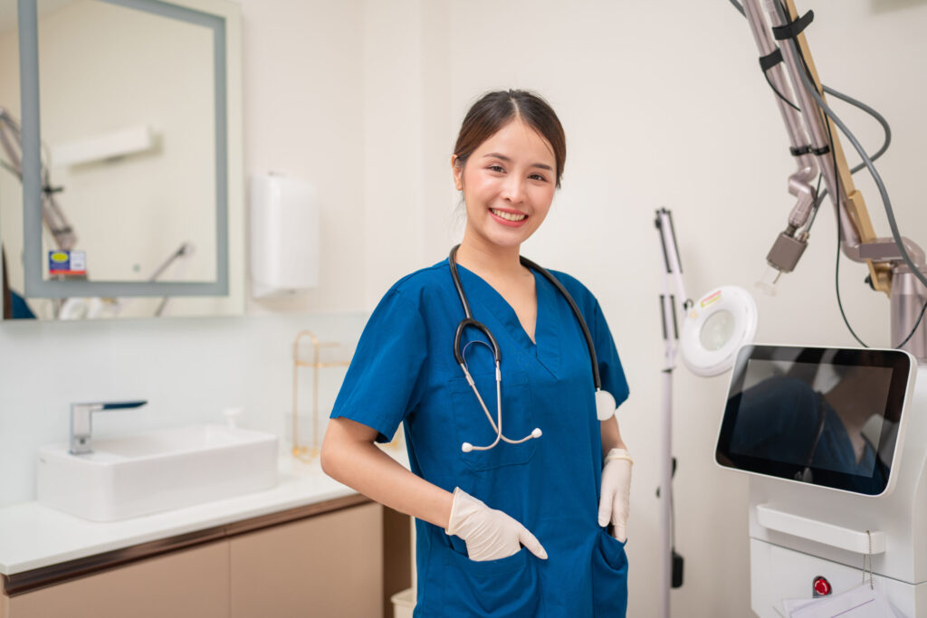 Nurse in scrubs with stethoscope.