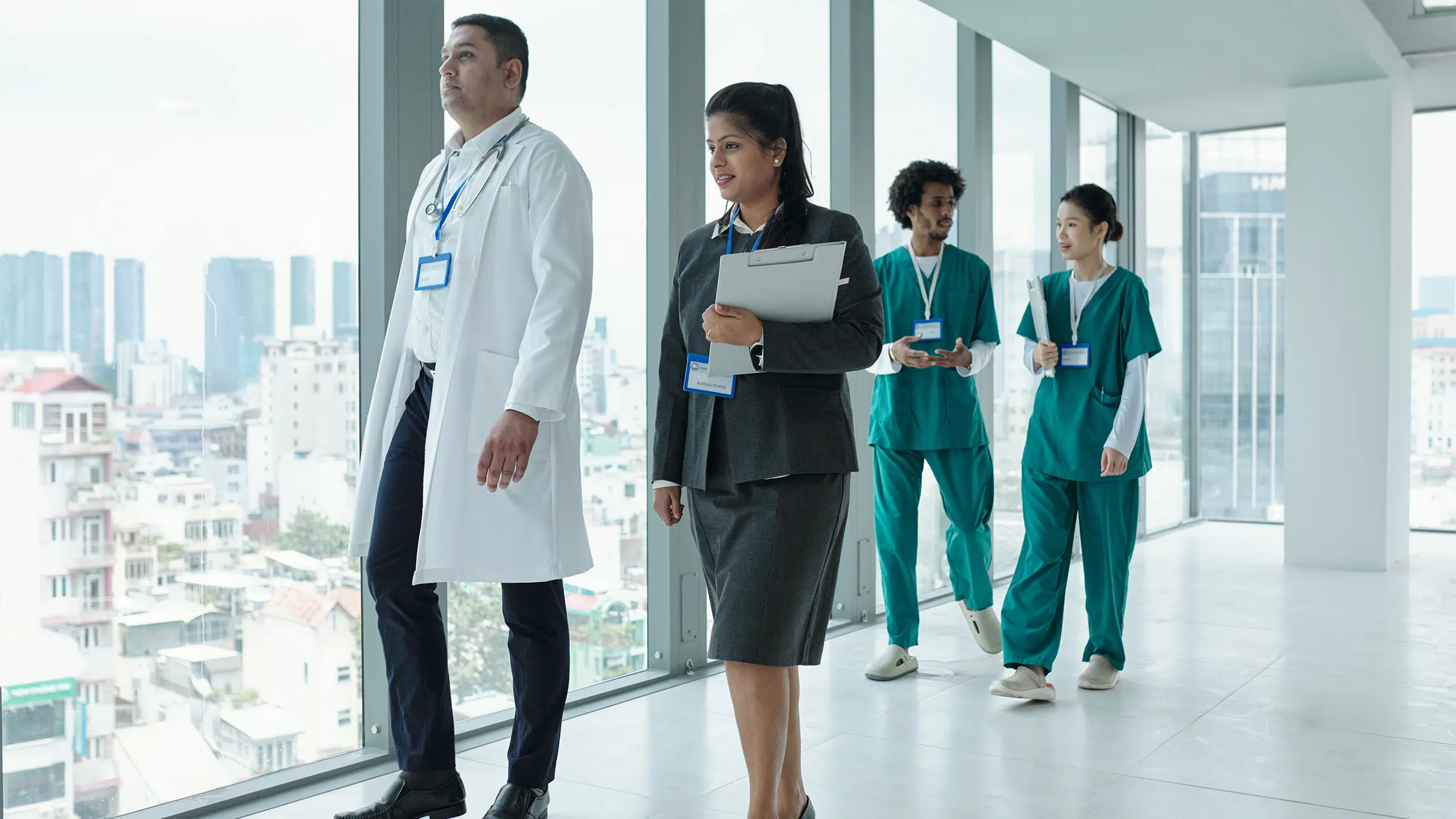 2025 Forecast: Healthcare Staffing Innovations and Challenges 1 medical business executives and doctors on their way to a meeting.