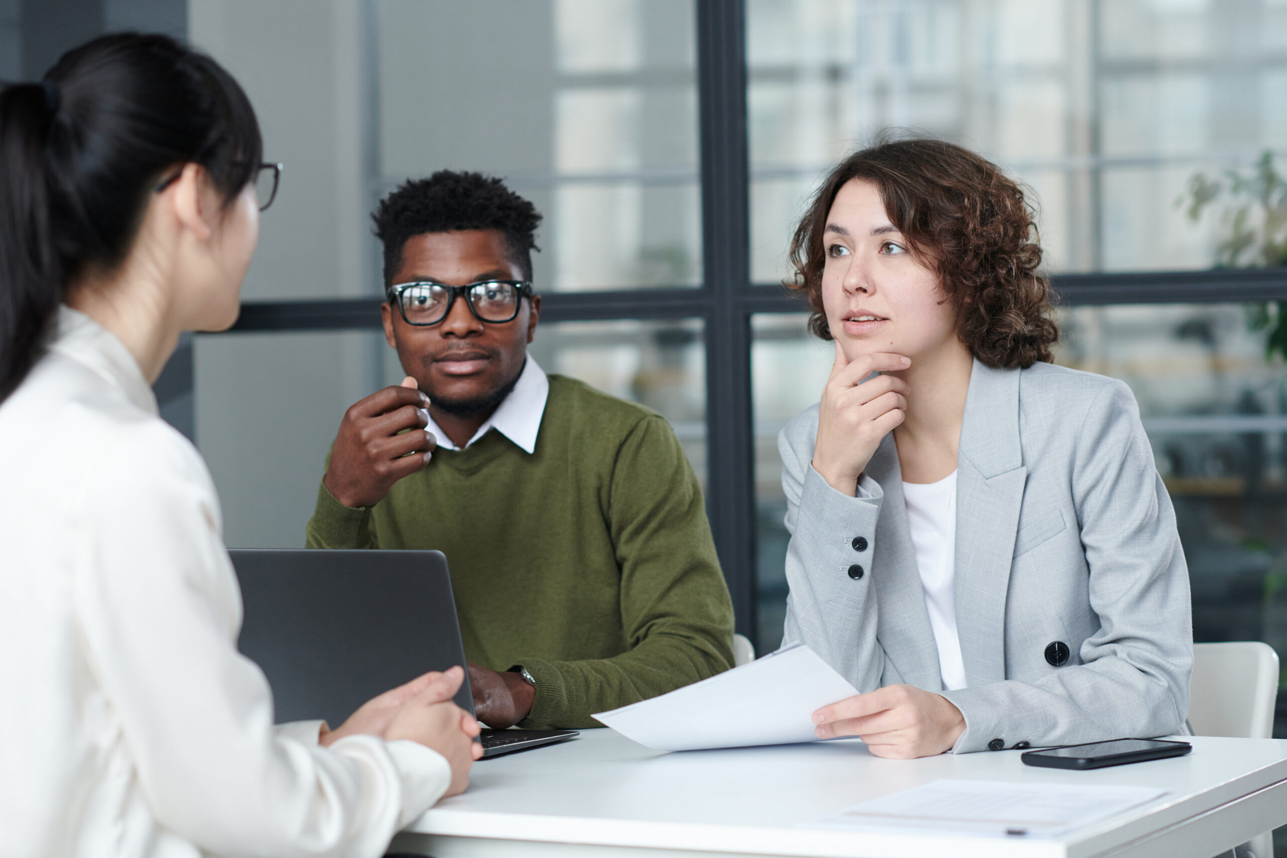 Job interview in modern office setting.