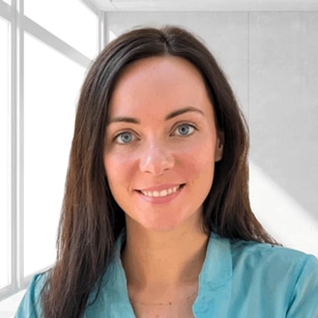 Woman in blue shirt, bright background.