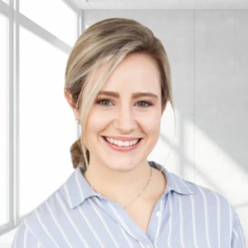 Woman in striped shirt, indoor setting.