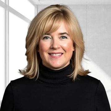 Woman in black turtleneck, indoors.