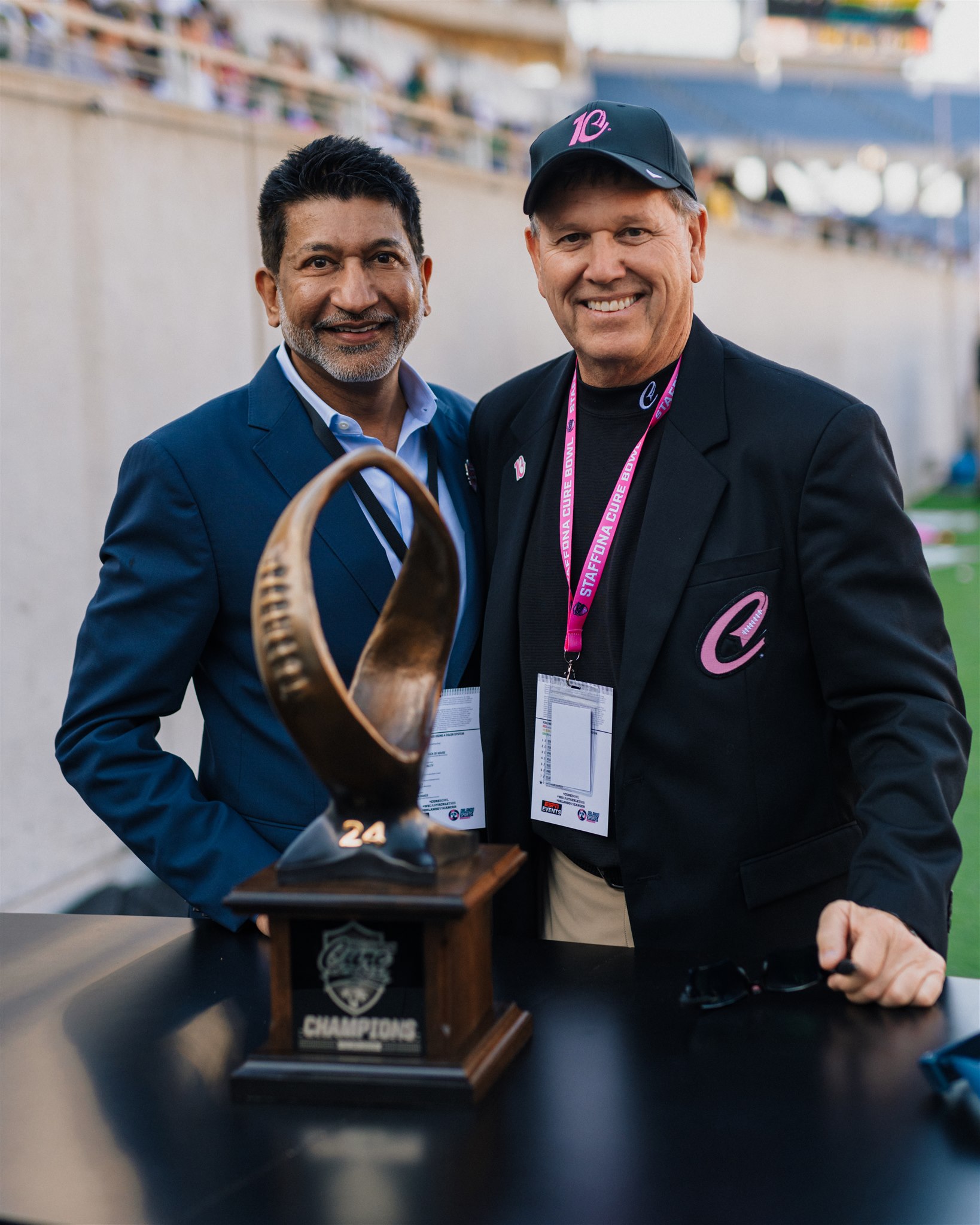 Two men with a trophy
