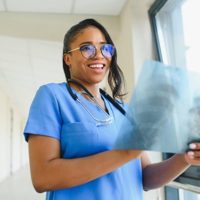 Doctor examining patient's X-ray image.
